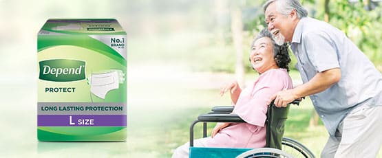 elderly man pushing elderly woman in a wheelchair with Depend protection Tape product pack, and a 'learn more' button